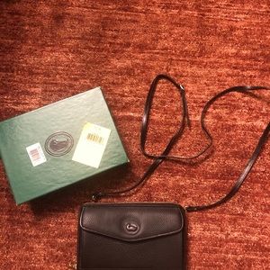 Dooney & Bourke “large zip-along”